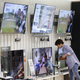 A woman looks at televisions at its store in Seoul, South Korea.
